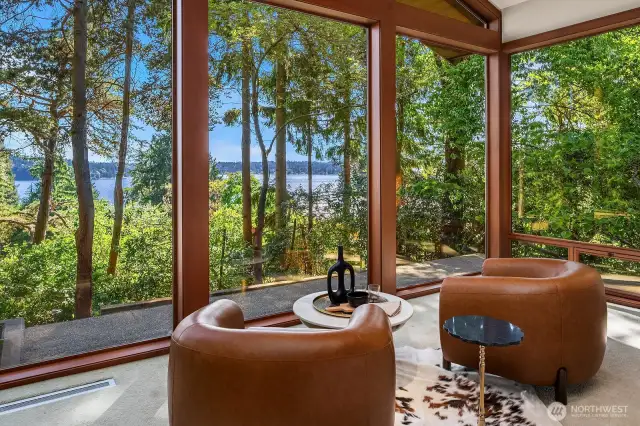 Whether framed by lush summer foliage or the bare branches of winter, the panoramic lake view remains spectacular—and on clear days, even the Olympic Mountains come into sight.