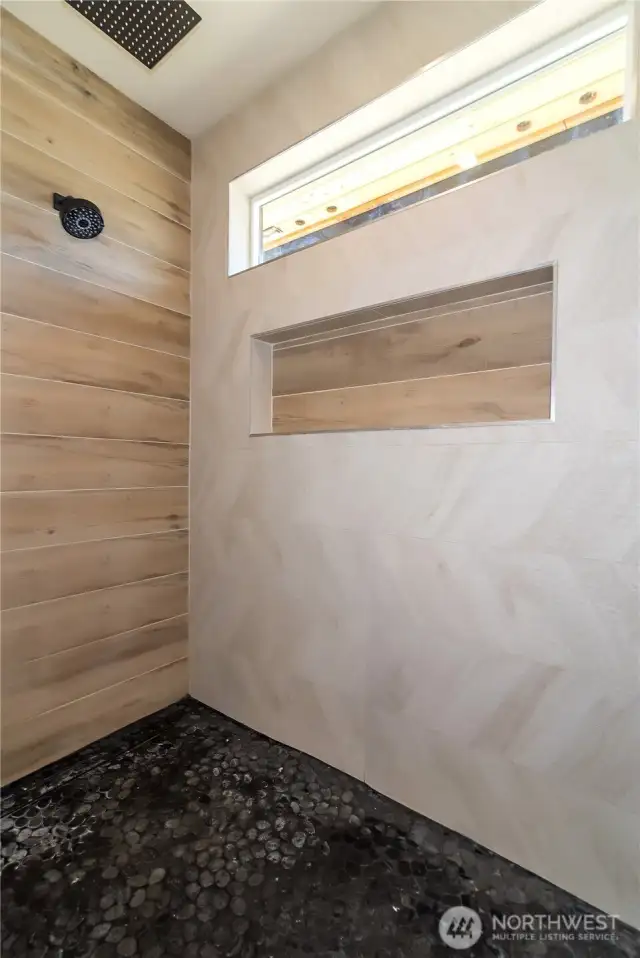 Walk in shower in primary with custom tile and niche
