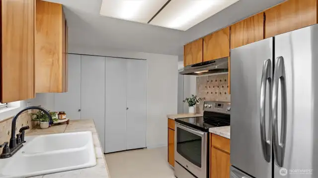 Kitchen has new tile flooring.