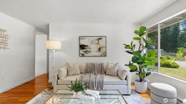 Living area has original hardwood floors and double pane windows