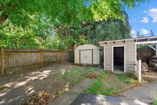 Two storage sheds. One with power and a one car carport