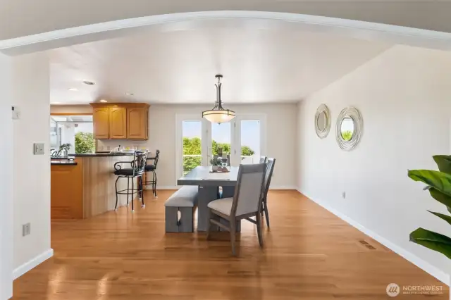 See right thru to the gorgeous views!  This open concept dining room is HUGE. Lots of room for your buffet or armoire.