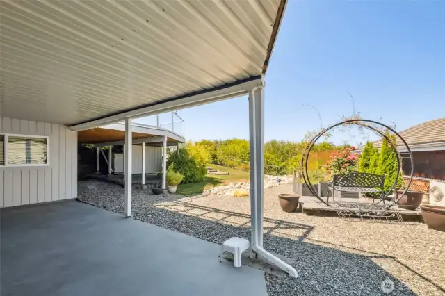 Covered patio at the walkout basement slider. - The Moongate stays!