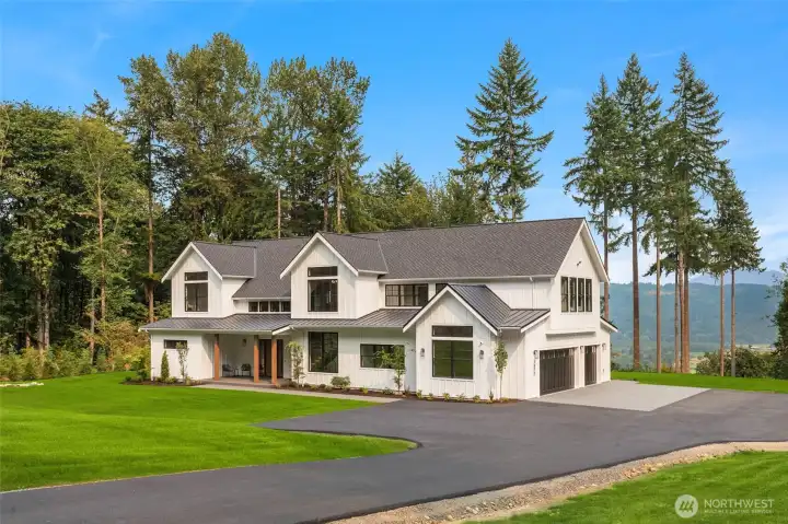 long private drive to home with a stunning view to greet you.