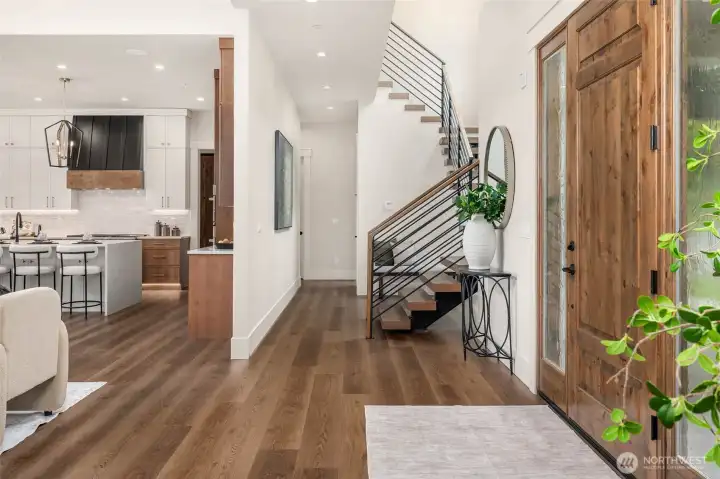 dramatic entry with over 20 foot ceilings and views out the great room.