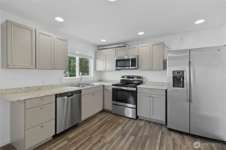 Remodeled kitchen with updated cabinetry and countertops