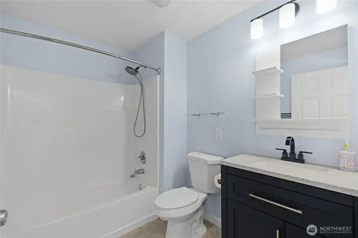 Beautifully updated full bath with clean finishes