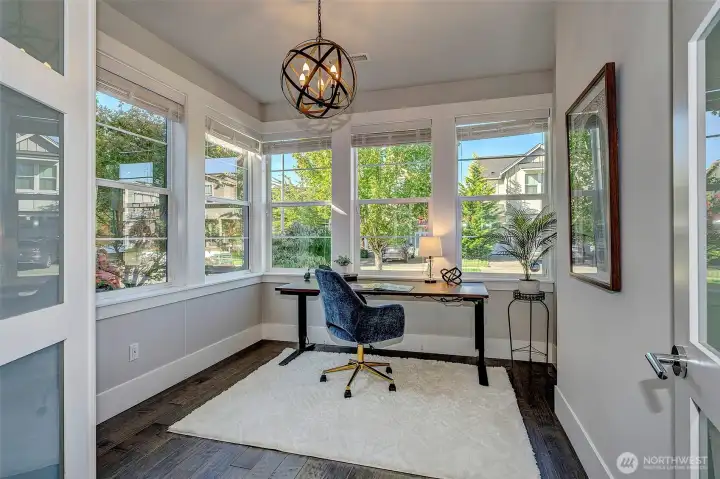 Enter the office through the double French doors. Large windows make it feel light & bright