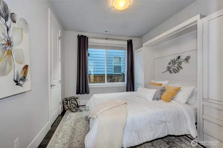Bedroom 1 -Guest bedroom on main floor with built-in Murphy bed