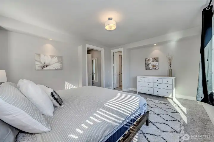 Primary bedroom with walk-in closet and luxurious 5-piece ensuite