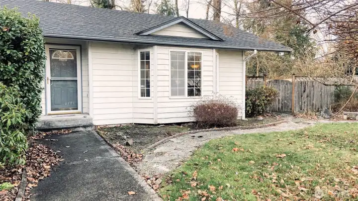 View of the front door and the bay window.