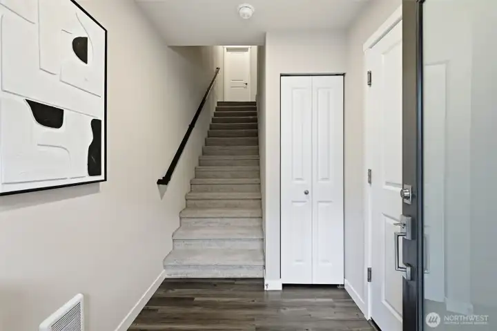 The entryway has a coat closet and garage access.