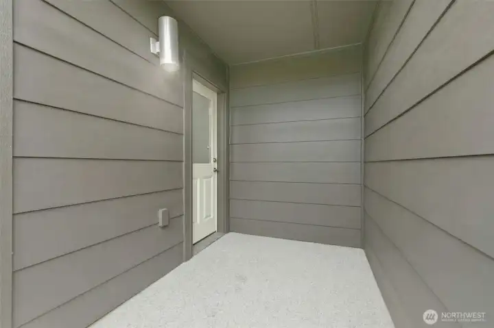 The door at the back of the garage opens to the backyard.