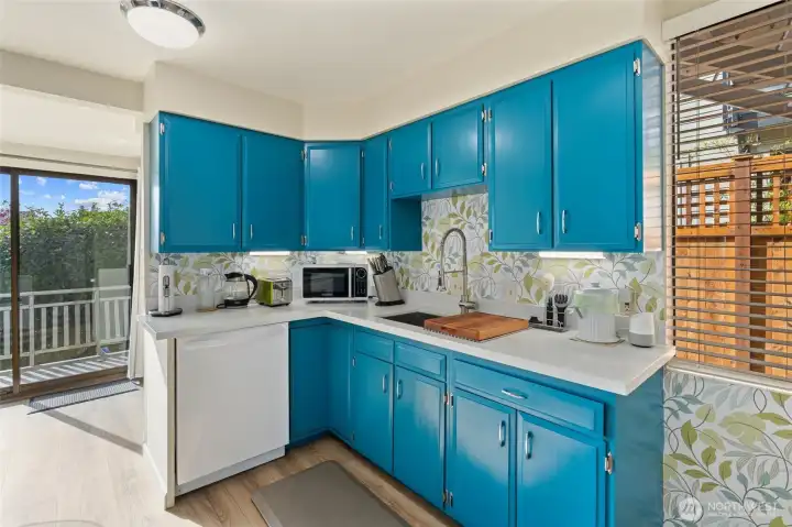 Unit 2 kitchen with quartz counters and spacious storage pantry
