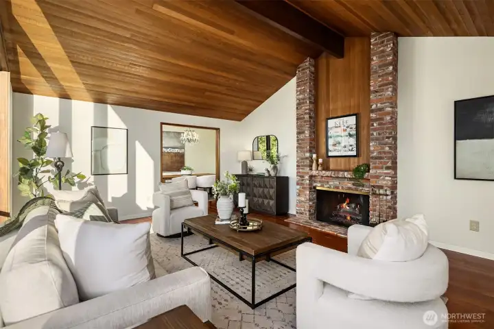 Formal Living room has fireplace and beautiful vaulted ceiling