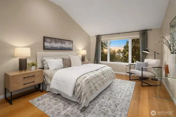 The Primary Bedroom also has a vaulted ceiling and gorgeous west facing views.