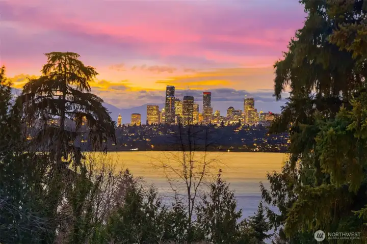 Partial views of the Seattle City Skyline, Lake Washington and snow covered Olympic  Mountains.
