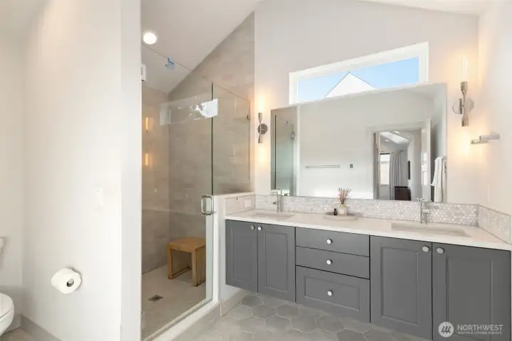 Dual sink vanity, with plenty of storage, & natural light