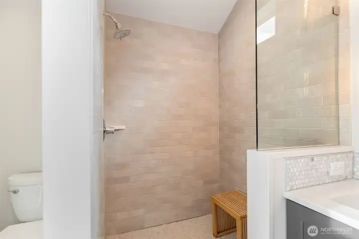 Gorgeous walk-in shower with frameless glass surround