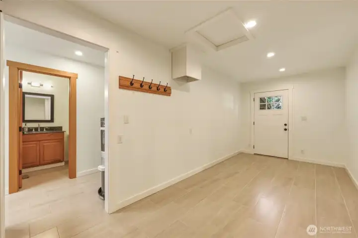 Separate entry from back patio to main floor primary bedroom