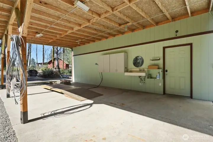 Attached carport with small vehicle lift