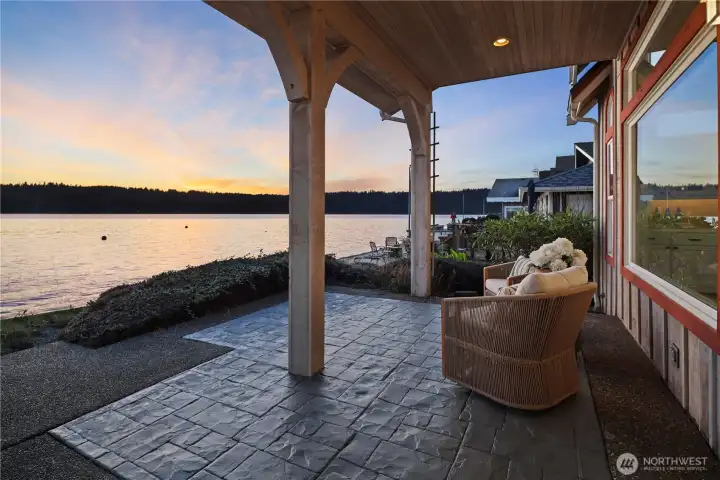Enjoy year-round outdoor living on this covered patio, perfectly positioned along the water for peaceful mornings and evening sunsets.