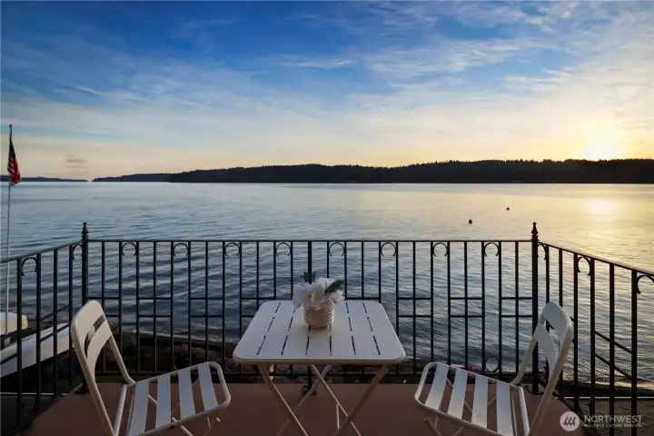 Step out from the primary suite onto a private balcony and take in the calming waterfront setting.