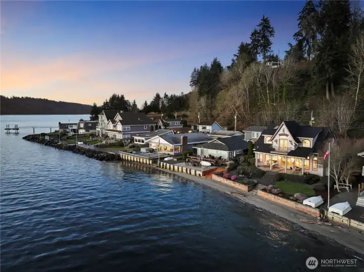 Beautiful shoreline perspective highlighting the home’s exceptional waterfront location.