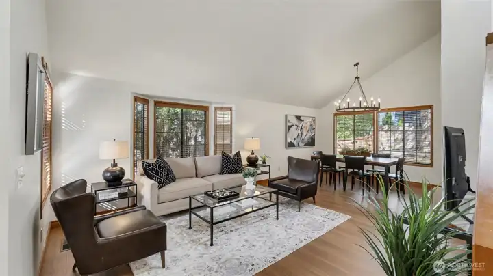 A beautiful vaulted ceiling above the living rom and dining rooms. The entire interior has been recently painted plus brand new wood floors.
