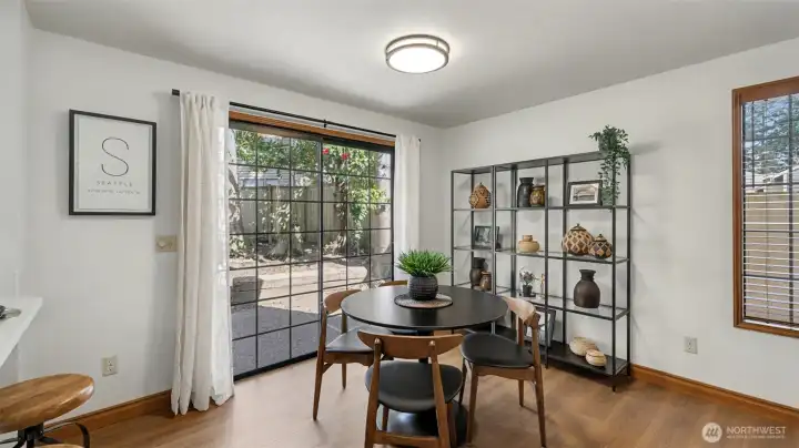 Just off the kitchen is a perfect eating nook next to 2 sliding glass doors.