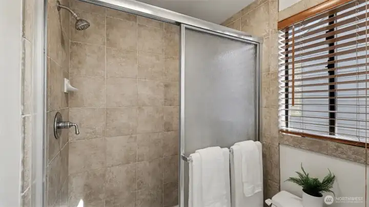 The shower has been fully tiled.