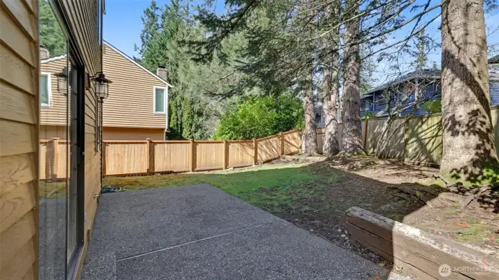 There is a large patio and it has been fully fenced.