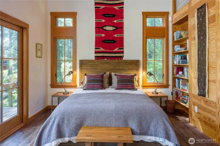 Interior of guest cabin with many built ins for storage and books