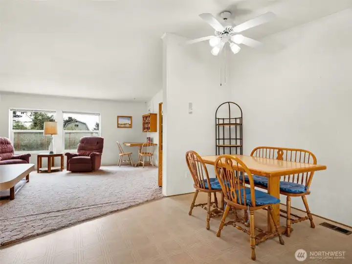 Dining space with open flow into the living room and kitchen.