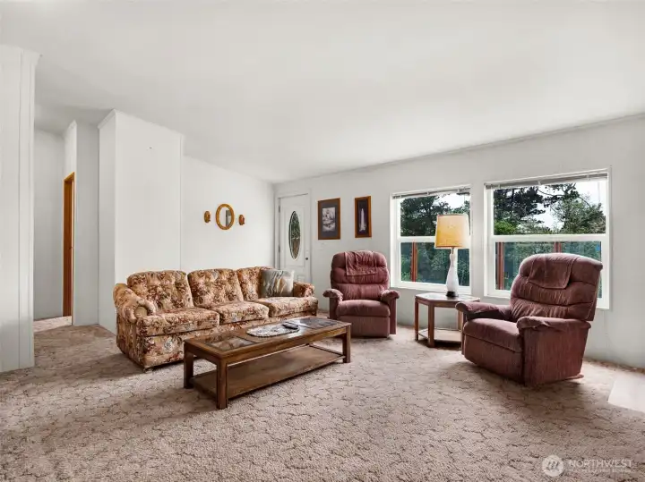 Spacious living area with abundant natural light and open layout.