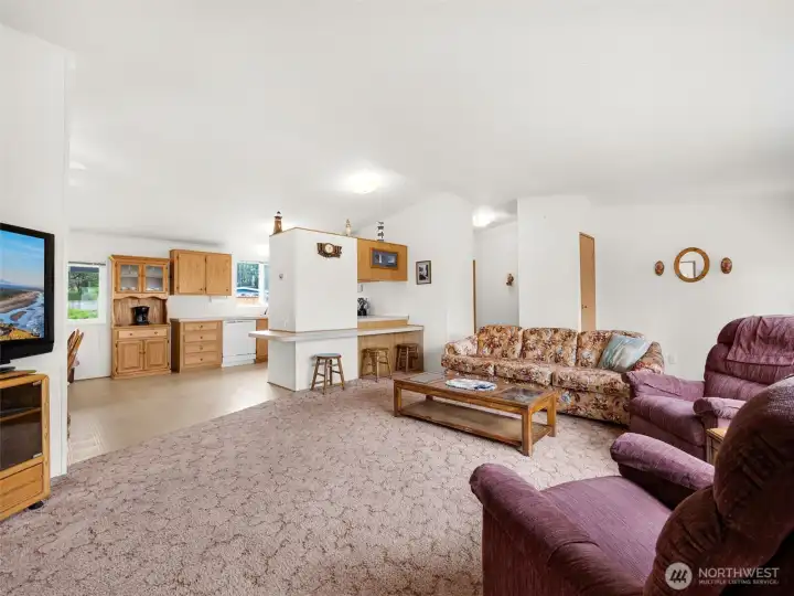 Open-concept living area connecting seamlessly to the kitchen and dining spaces.