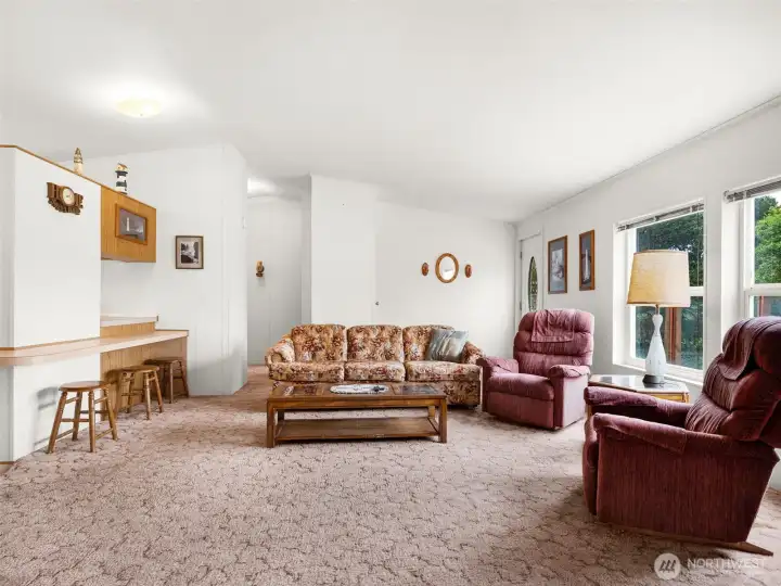 Spacious living room with flexible furniture layout and abundant natural light.