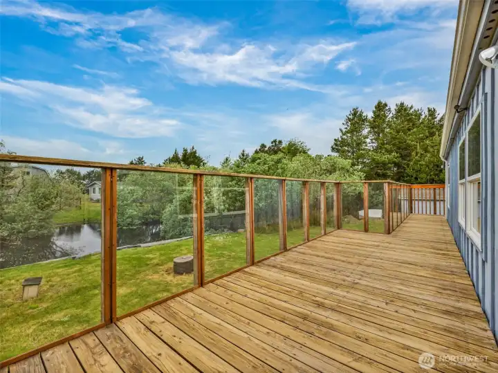 Expansive back deck with canal frontage and room for outdoor entertaining.