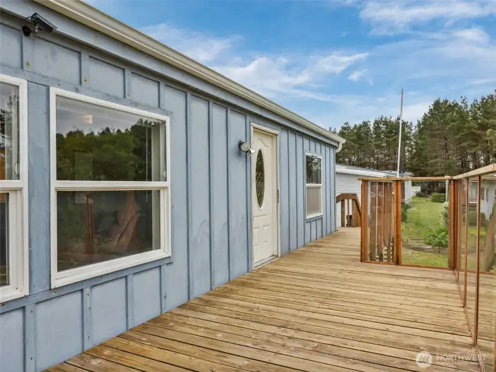 Side exterior view highlighting deck access and outdoor living space.