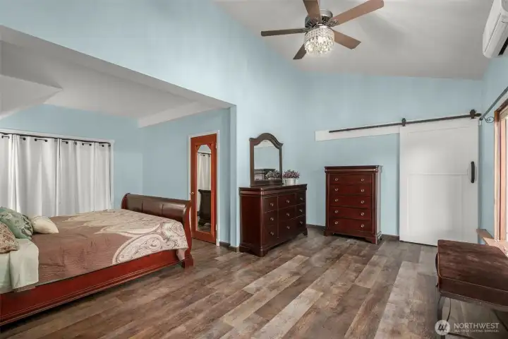 Main floor primary bedroom with 3 closets