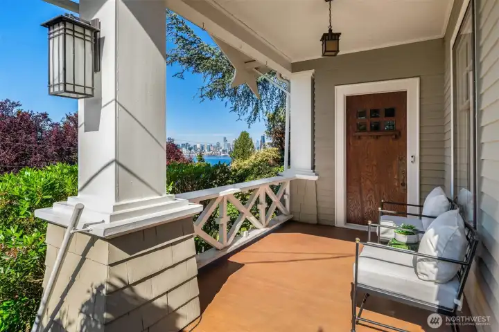 The covered porch features fine craftsman detailing and fixtures with plenty of room to soak in the view. The covered porch features fine craftsman detailing and fixtures with plenty of room to soak in the view.