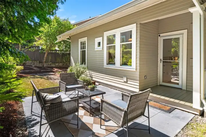 The paver patio just off the back porch and kitchen is bathed in sunlight and perfect for barbecues and friends. The paver patio just off the back porch and kitchen is bathed in sunlight and perfect for barbecues and friends.