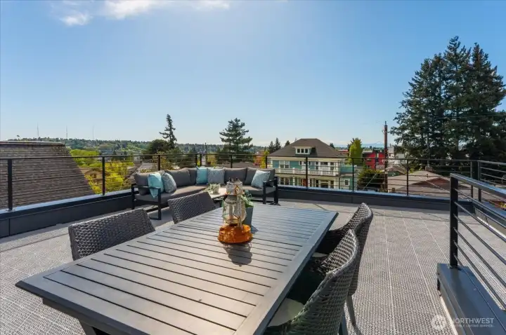 Big views from the rooftop deck. Photo of model unit, 4116 A Burke Ave N - buyer to verify.