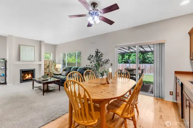 Enjoy the electric fireplace in the living room looking from the kitchen
