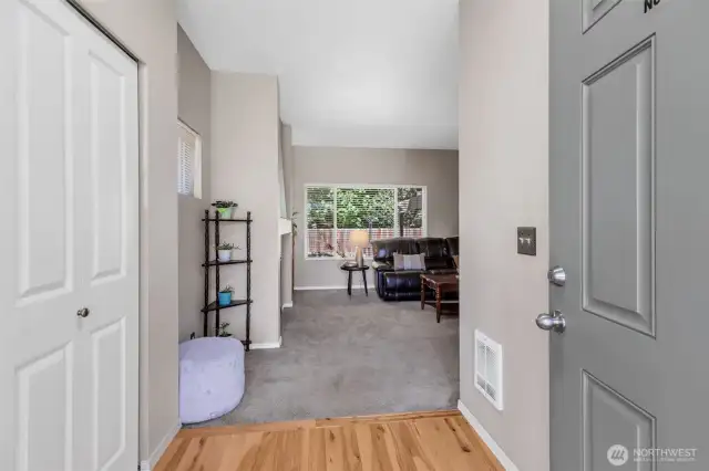 Formal entry with hardwood floor and large closet