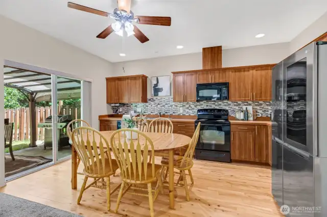 Open concept kitchen with access to the fully fenced yard