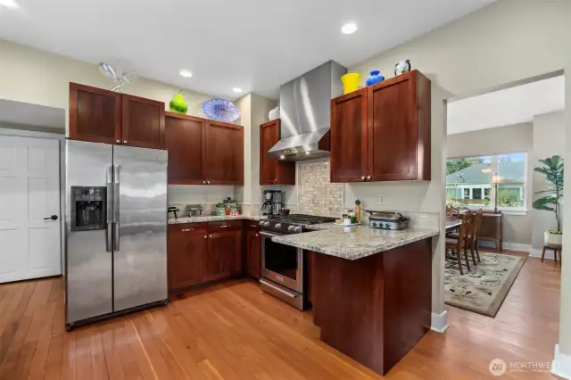 The kitchen has a fabulous work triangle with the cooking area separate from the prep and dishwashing area. There is also an eating bar for two.