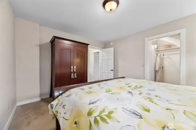 Looking across the primary bedroom toward the walk-in closet.