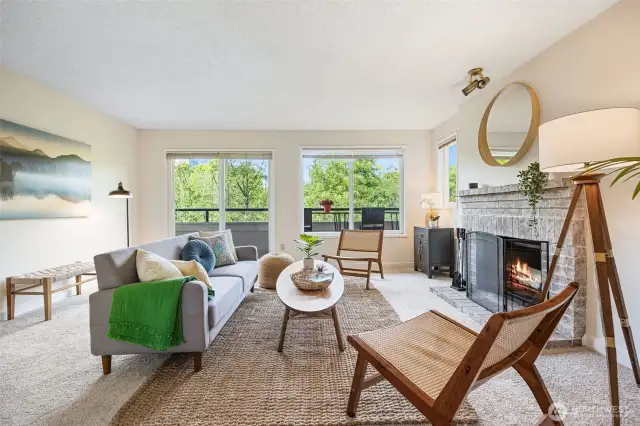 Living room with wood-burning fireplace.
