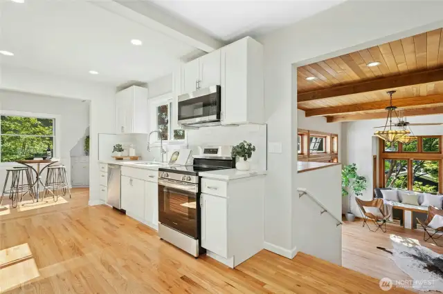 Just a few steps down into the dramatic family room allow easy flow between your spaces